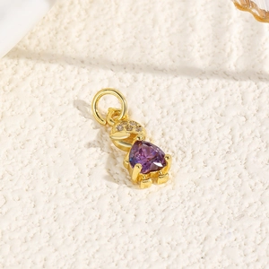 Detailed macro view of heart-shaped purple zircon turtle pendant in 18k gold plating