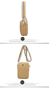 Detail of khaki nylon crossbody bag showing side quilting, earphone port and woven strap