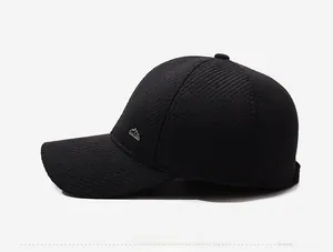 Detail view of winter baseball cap with ribbed texture and silver mountain logo side profile
