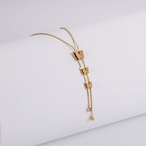 Golden butterfly tassel necklace with frosted pendants on a fine snake bone chain