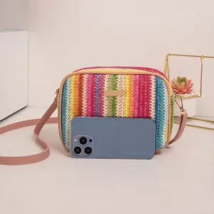 Rainbow woven mini crossbody bag with pink strap and colorful wave pattern texture