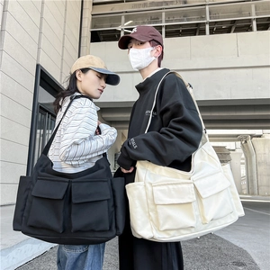 Large capacity canvas messenger bag for students in black and beige workwear style