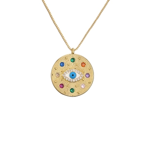 Golden evil eye pendant necklace featuring colorful stones and shimmering white crystals