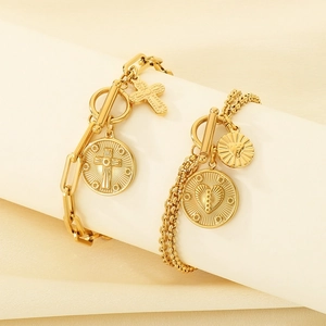 Double-layered gold paperclip chain bracelet with OT clasp and heart cross pendants