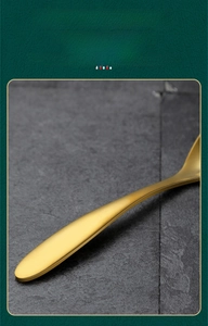 Macro shot of durable matte gold SUS304 stainless steel spoon with sleek handle