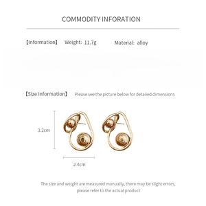 Detailed view of twisted gold alloy earrings with 3.2cm x 2.4cm size specifications