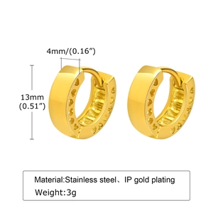 Detail view of 13mm gold stainless steel hoop earrings with cutout heart patterns and sizing