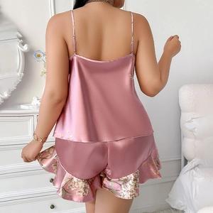 Women silk satin pajama set with spaghetti strap top and floral hem shorts in pink