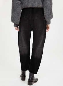 Rear view of black high-waisted cargo jeans showing back pockets and straight cut fit