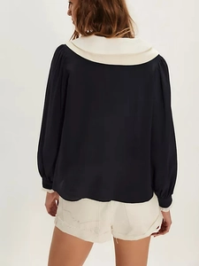 Detail of French bow chiffon blouse showing the white sailor collar from a back view
