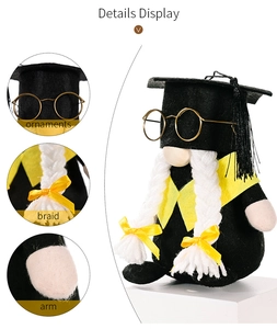 Detail display of graduation gnome with black mortarboard, glasses and braided pigtails