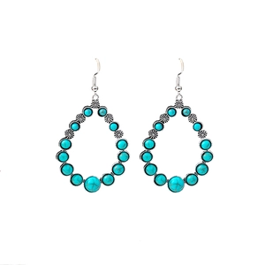 Bohemian silver water drop earrings with blue turquoise stones on white background