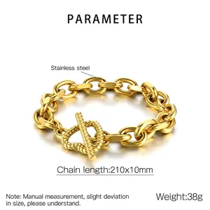 Detail of chunky golden stainless steel chain bracelet with textured ring and toggle clasp