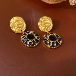 French vintage style round earrings with gold wavy metal and black enamel finish