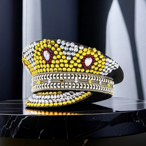 Sparkling captain hat with yellow rhinestones and gold chains for festive parties