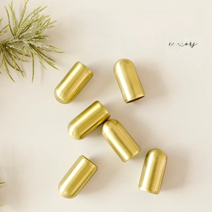 Golden metal bullet-shaped Christmas bells and decorative caps set for tree hanging ornaments