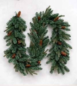 Close-up of luxury PE mixed Christmas garland with natural pine cones on white background