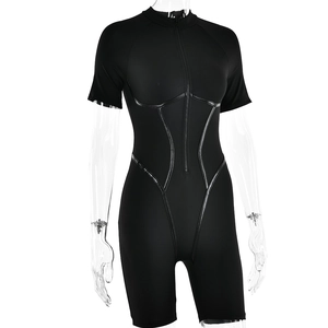 Detail of black sporty bodysuit with front zipper and glossy contouring lines on fabric