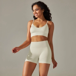 Detail of oatmeal ribbed knit yoga set showing V-neck sports bra and high-waist shorts