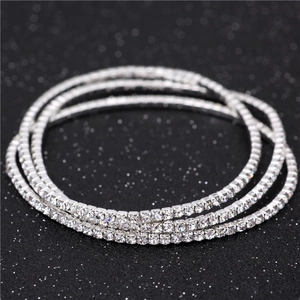 Macro shot of a three-piece silver rhinestone tennis bracelet set with brilliant crystals