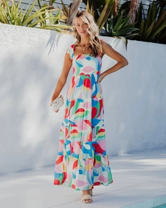 Detail of colorful abstract print maxi dress with tiered skirt and ribbon shoulder straps