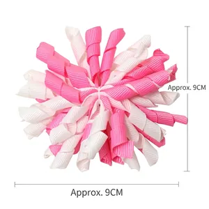Pink and white 9cm grosgrain ribbon spiral hair bow for kids with dimensions marked