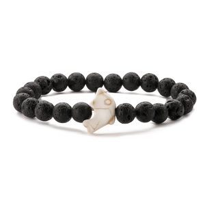 Lava stone beaded bracelet featuring a white dolphin charm and elastic stretch cord