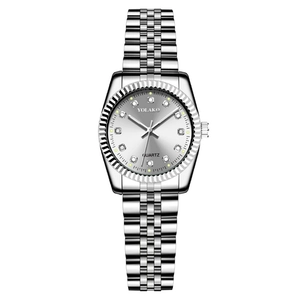 Close-up of silver quartz watch featuring diamond hour markers and polished steel strap