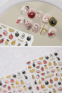 Detail of embossed fruit nail stickers featuring strawberry and avocado patterns