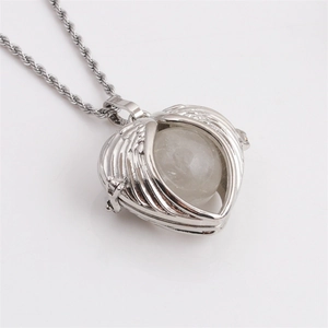 Silver angel wing heart necklace with a white translucent bead on a rope chain