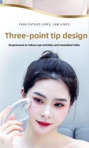 Close-up of clear 3D facial scraping tool for eye and nasolabial fold massage care
