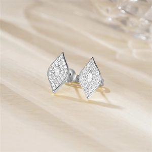 Macro shot of geometric S925 sterling silver stud earring with pavé zircon details