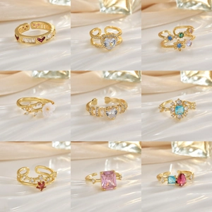 Elegant set of 9 gold open rings featuring colorful zircon heart and geometric shapes