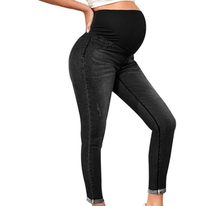 Detail view of charcoal maternity jeans with high waist support and slim fit design