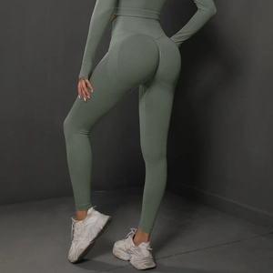 Detail of gray-green high waist seamless yoga leggings with peach butt lifting texture
