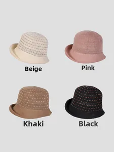 Close-up of linen knit sun hats in beige, pink, khaki and black with hollow stripe texture