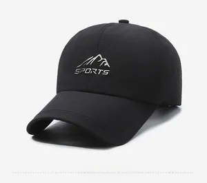 Detail view of the black quick-dry sports cap featuring embossed silver mountain logo