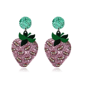 Close-up of pink glittery strawberry earrings featuring unique devil eyes design