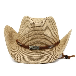 Detail of straw cowboy hat with ethnic leather band, vintage metal buckle and chin strap