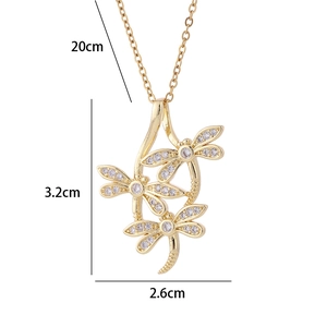 Detailed size view of gold dragonfly pendant with white zircons showing 3.2cm height