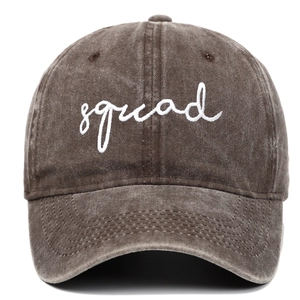 Close-up of white squad embroidery on washed distressed cotton baseball cap texture