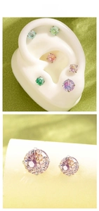 Close-up of 6mm and 8mm colorful zircon screw earrings on white silicone ear models