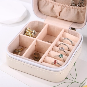 Portable square leather jewelry box in beige with pink velvet lining for rings and necklaces