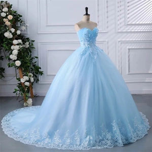 Light blue strapless ball gown with delicate white lace appliques and long train