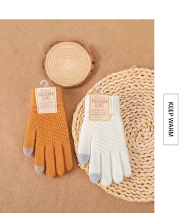 Detailed view of touchscreen knitting gloves with ribbed cuffs and warm textures