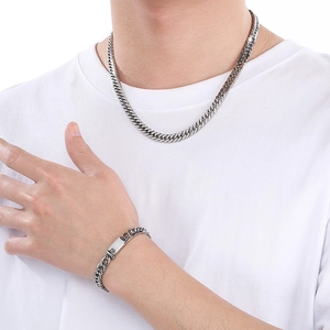 Hip hop silver stainless steel curb chain necklace and bracelet set on male model