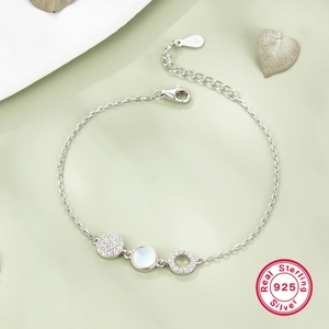 S925 sterling silver bracelet with shimmering mother of pearl and cubic zirconia charms