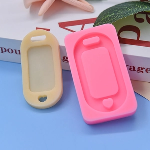 Pink silicone oval tag mold for DIY cake fondant and chocolate baking with heart cutout