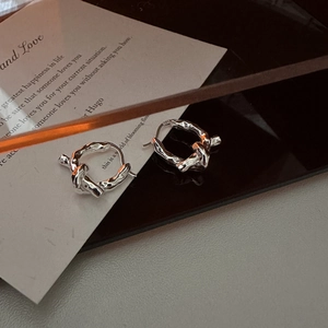 S925 sterling silver knotted hoop earrings with textured finish and minimalist design
