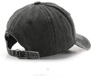 Adjustable metal buckle on distressed charcoal black washed denim baseball cap back